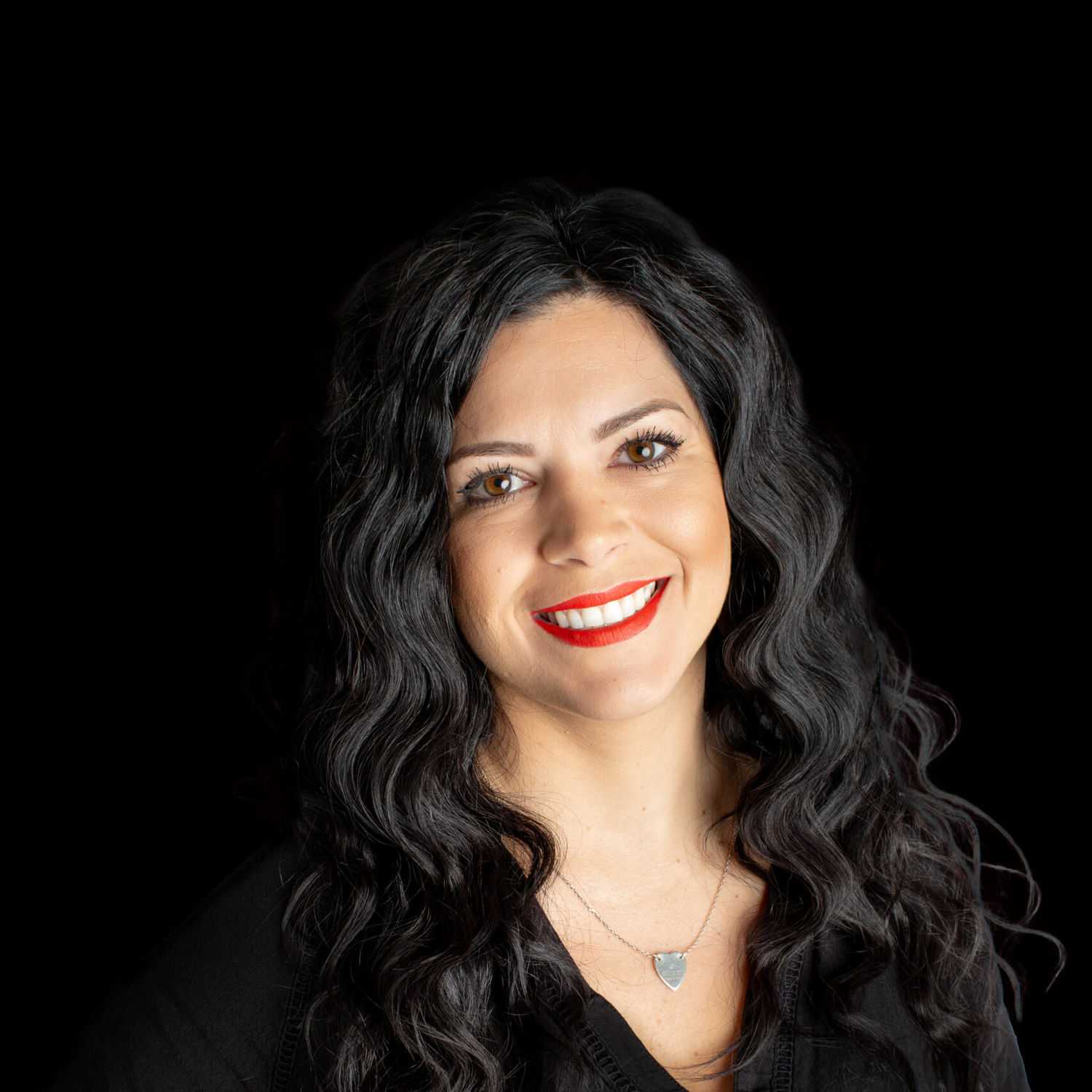 Portrait of Jessica, a professional stylist at Fusion Salon Avalon, showcasing their expertise and style.