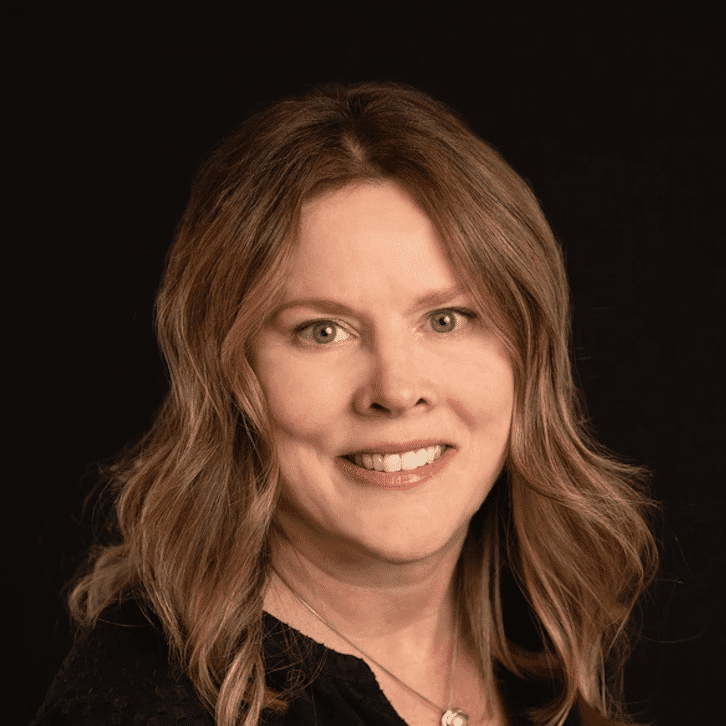 Portrait of Jackie, a professional stylist at Fusion Salon Avalon, showcasing their expertise and style.