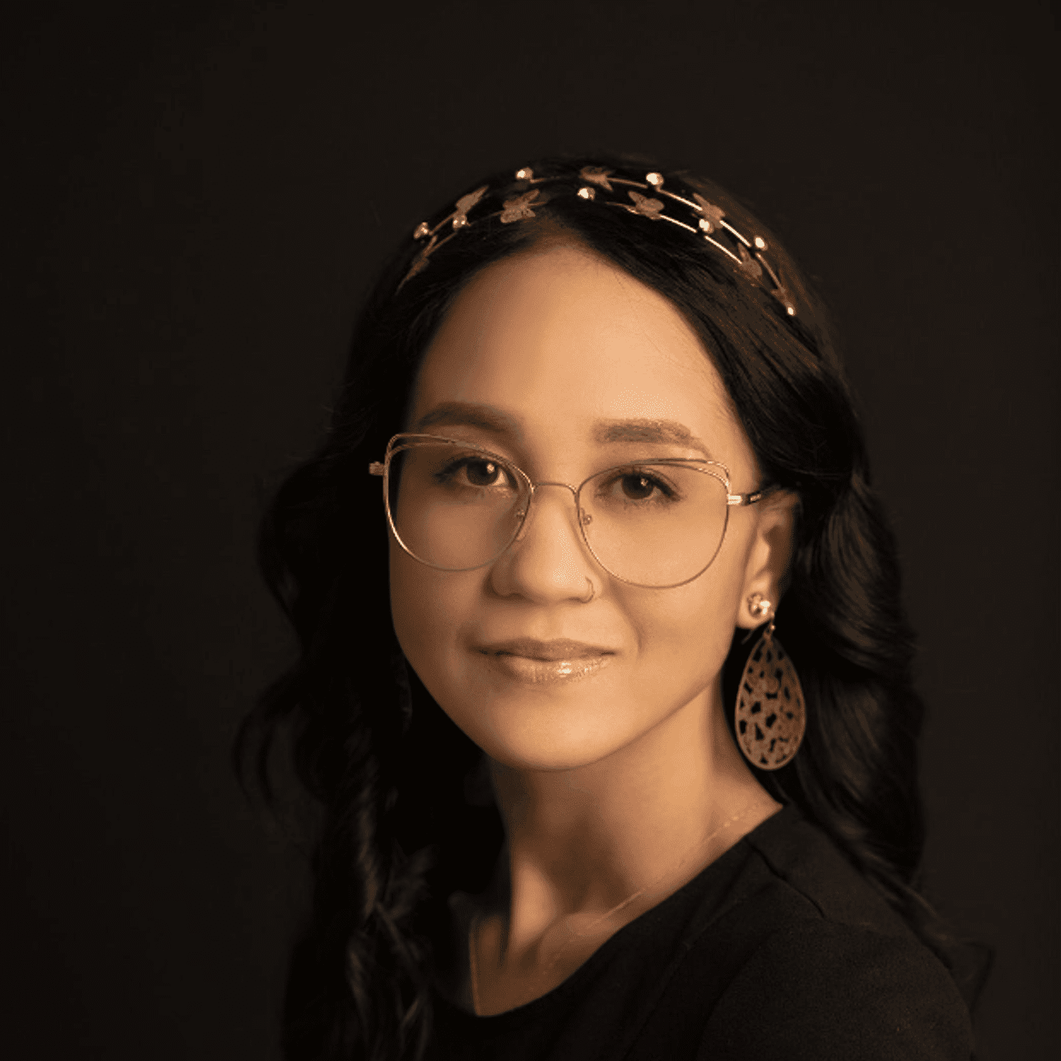 Portrait of Mariah, a professional stylist at Fusion Salon Avalon, showcasing their expertise and style.