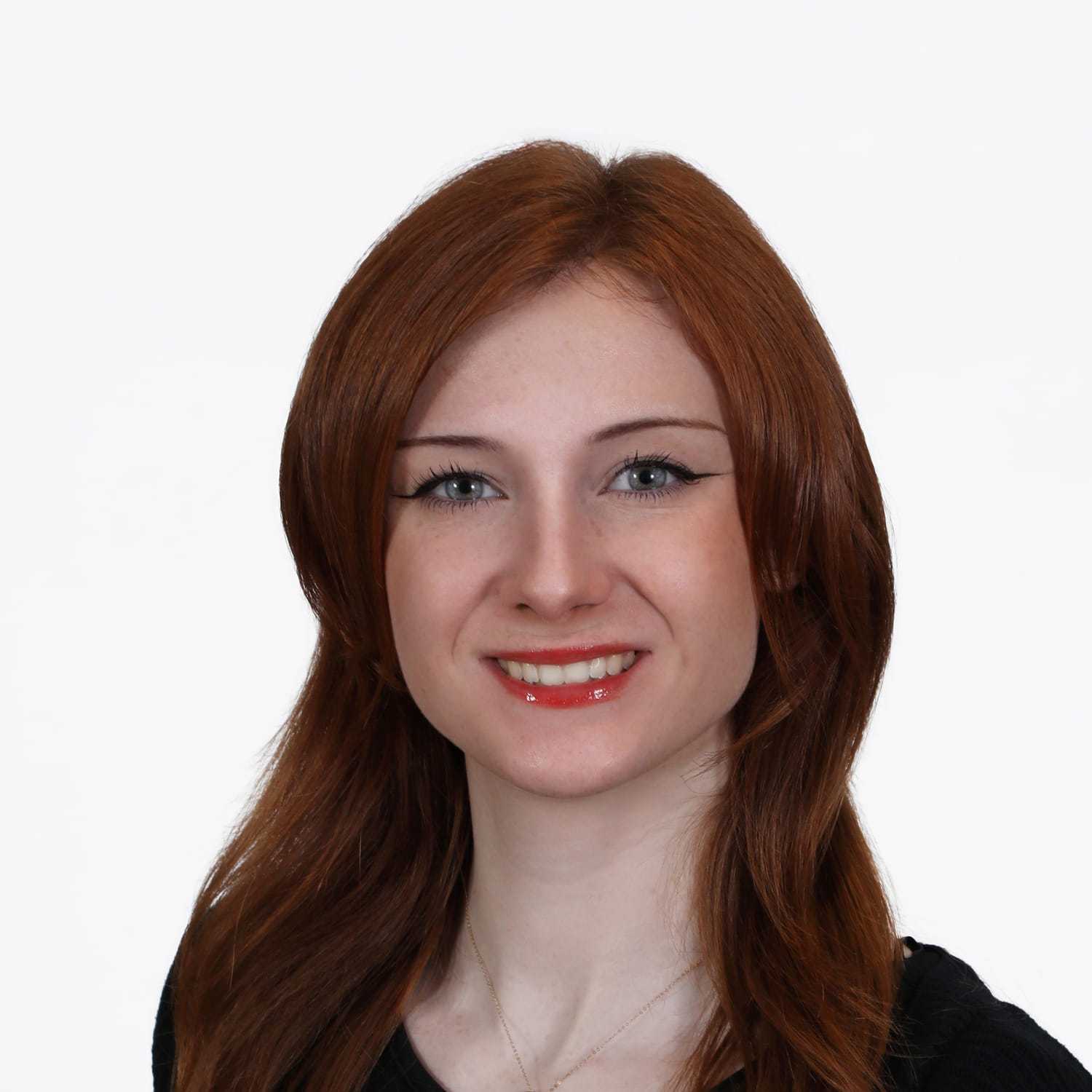 Portrait of Aine, a professional stylist at Fusion Salon Avalon, showcasing their expertise and style.