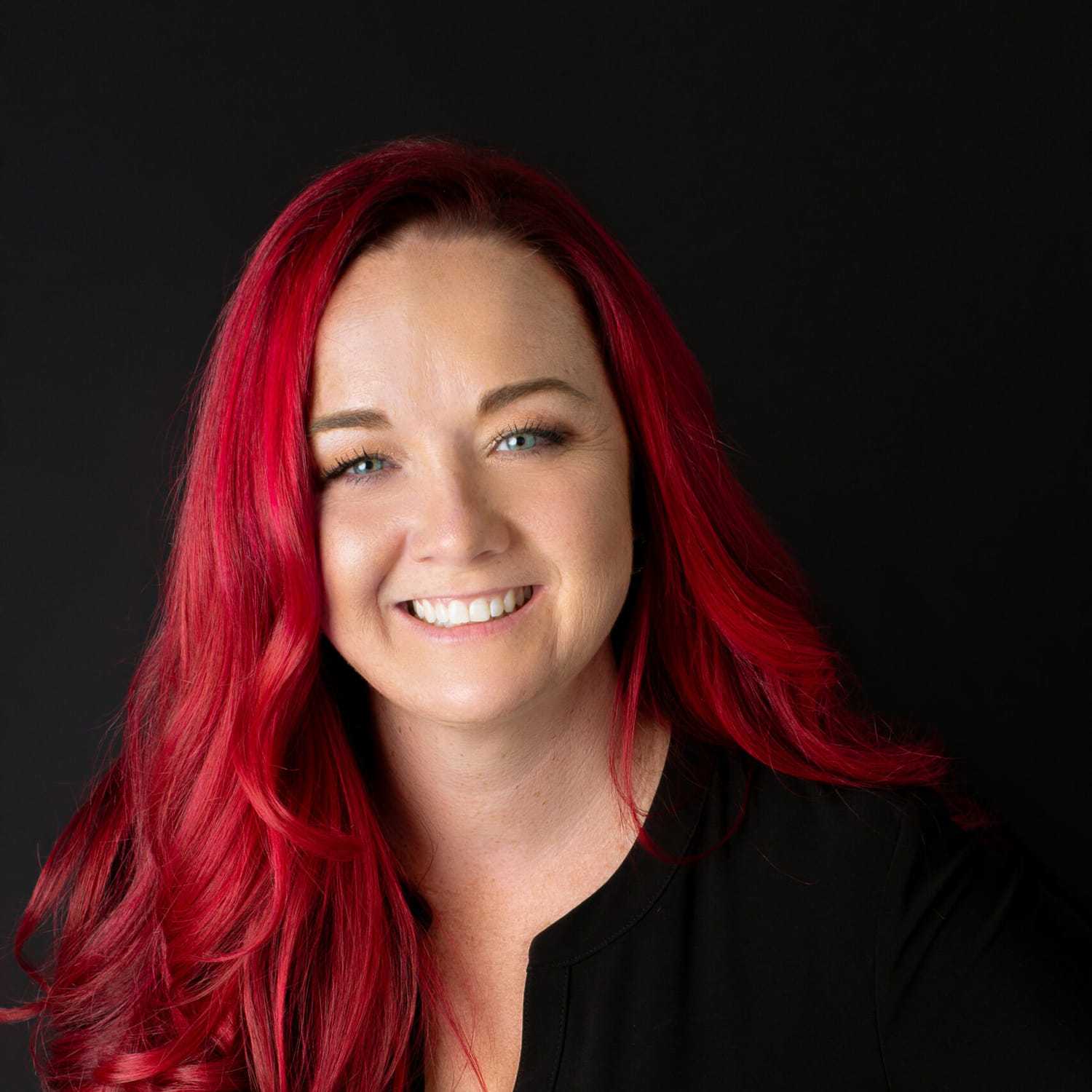 Portrait of Crystal, a professional stylist at Fusion Salon Avalon, showcasing their expertise and style.