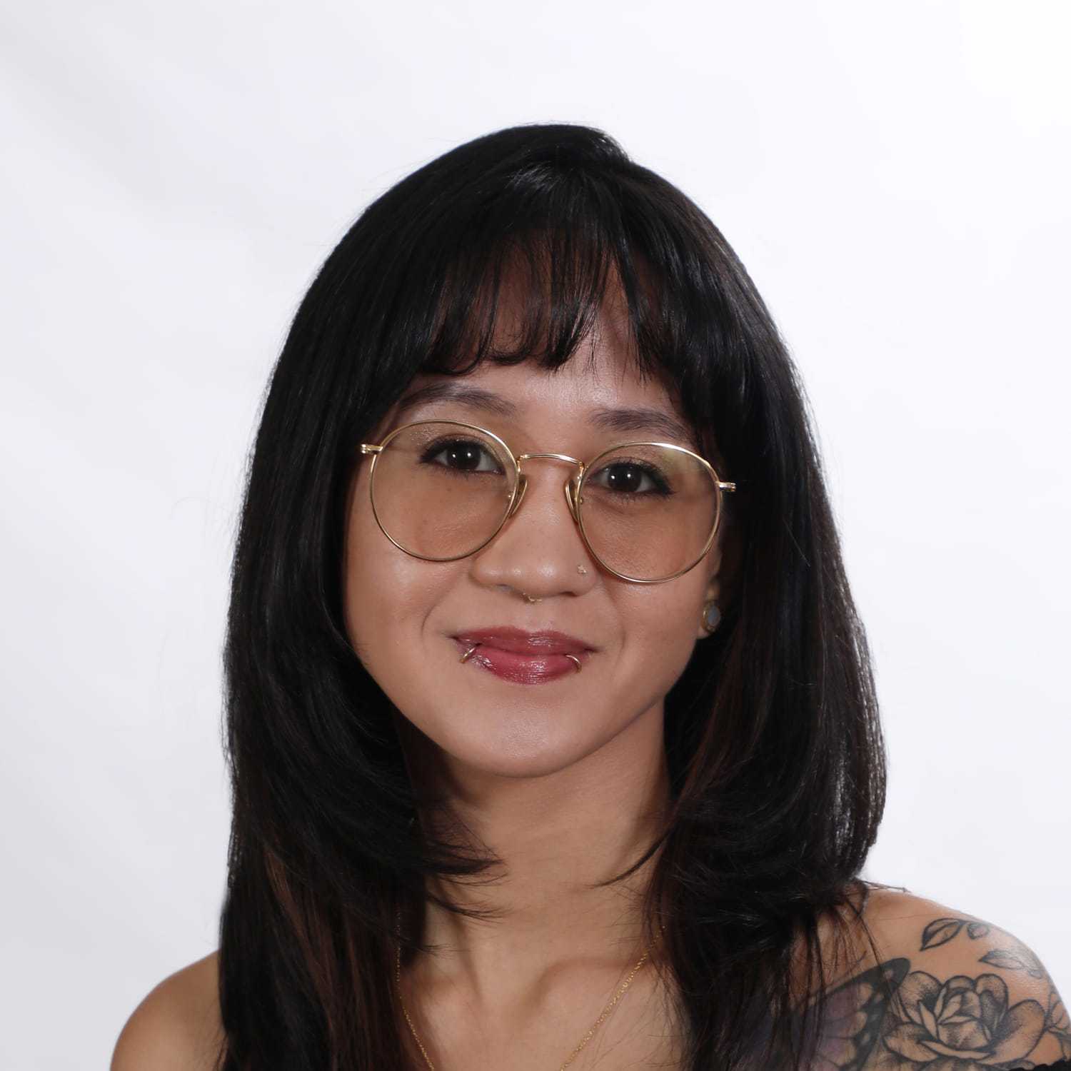 Portrait of Mariah, a professional stylist at Fusion Salon Avalon, showcasing their expertise and style.