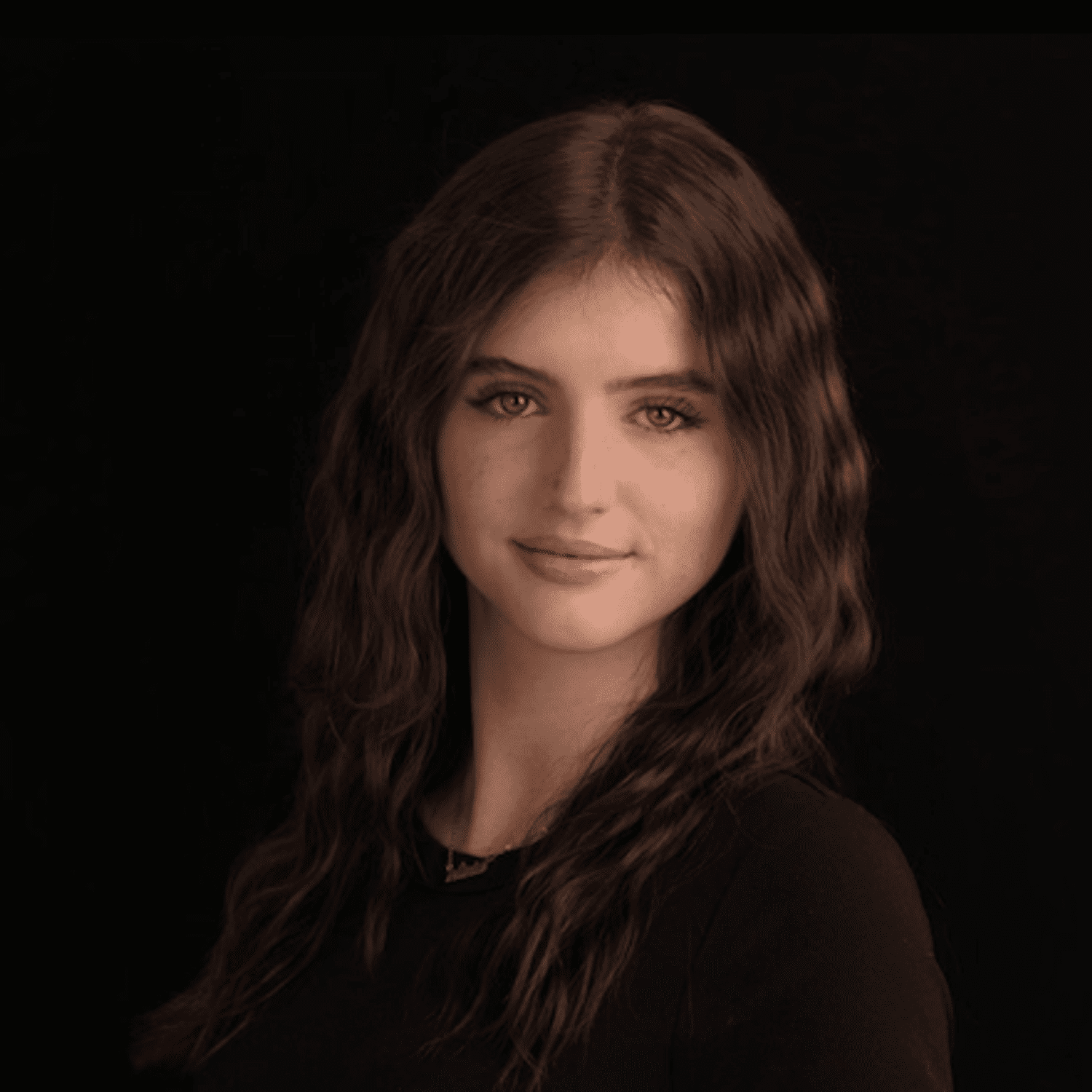 Portrait of Olivia, a professional stylist at Fusion Salon Avalon, showcasing their expertise and style.