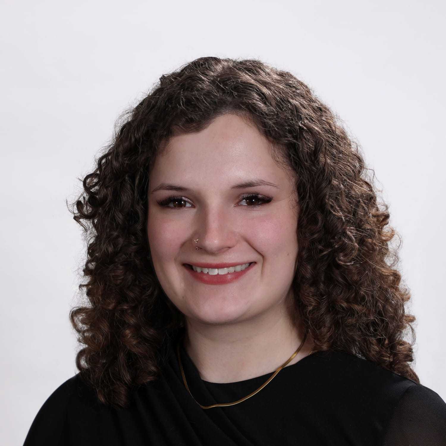Portrait of Savannah, a professional stylist at Fusion Salon Avalon, showcasing their expertise and style.