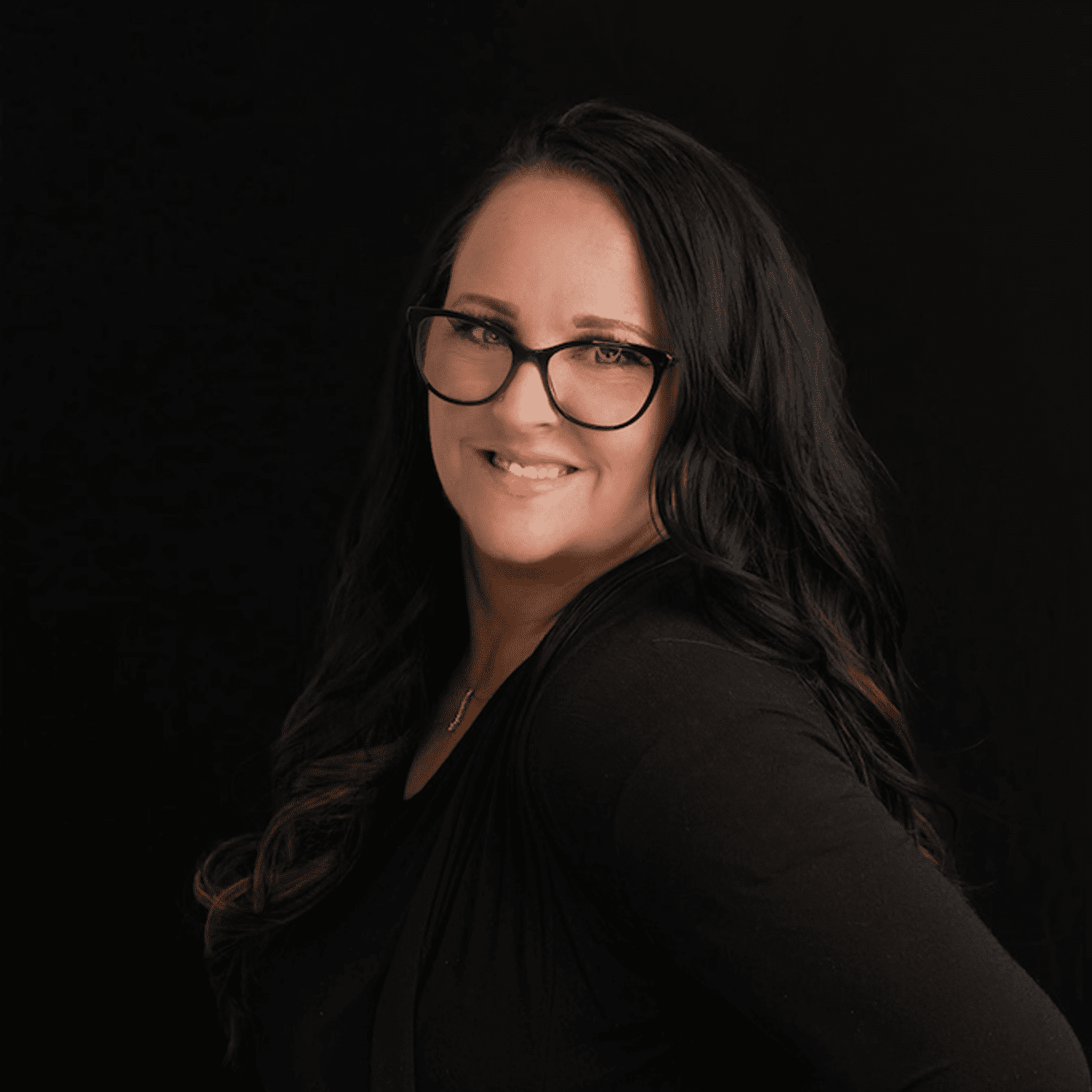 Portrait of Trish, a professional stylist at Fusion Salon Avalon, showcasing their expertise and style.