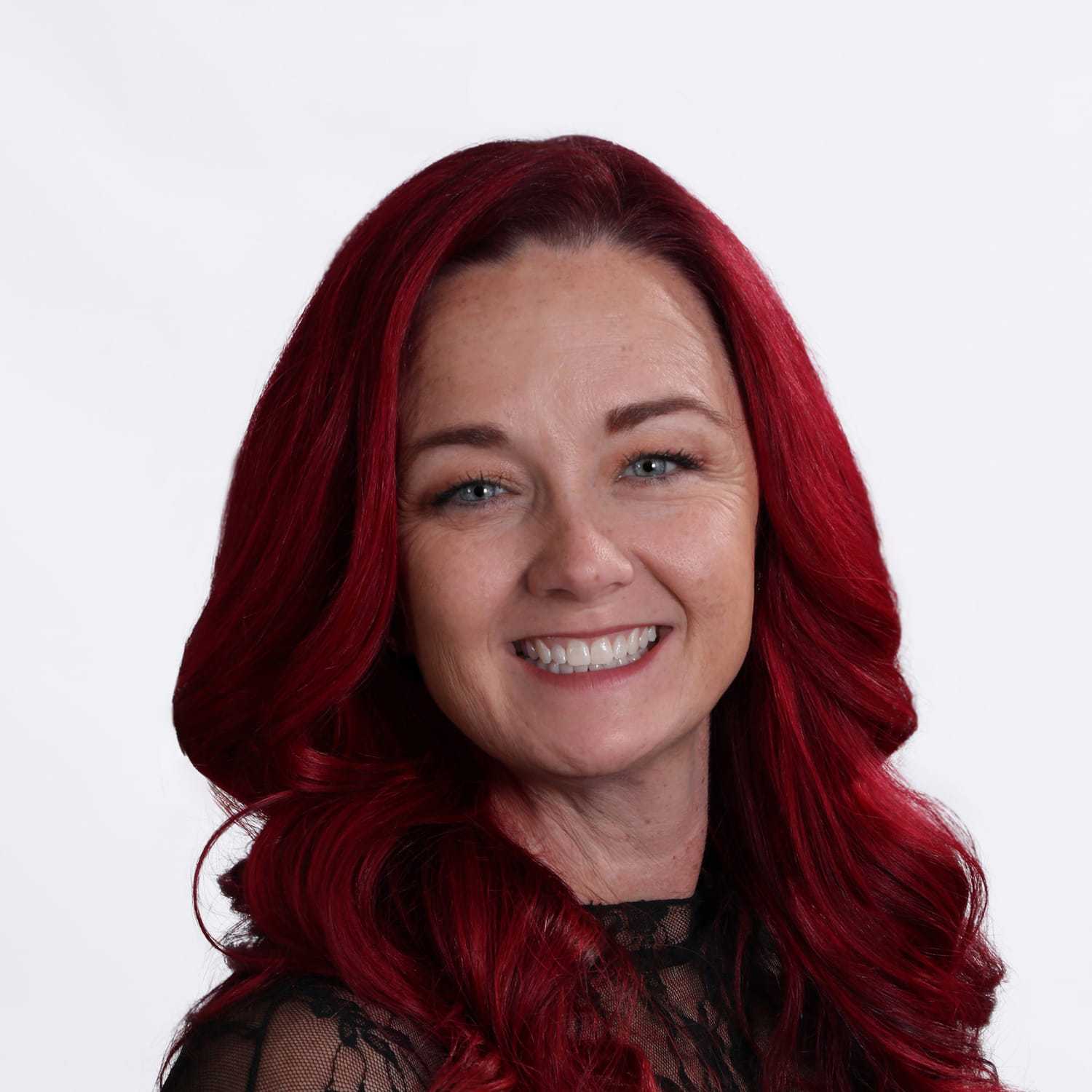 Portrait of Crystal, a professional stylist at Fusion Salon Avalon, showcasing their expertise and style.