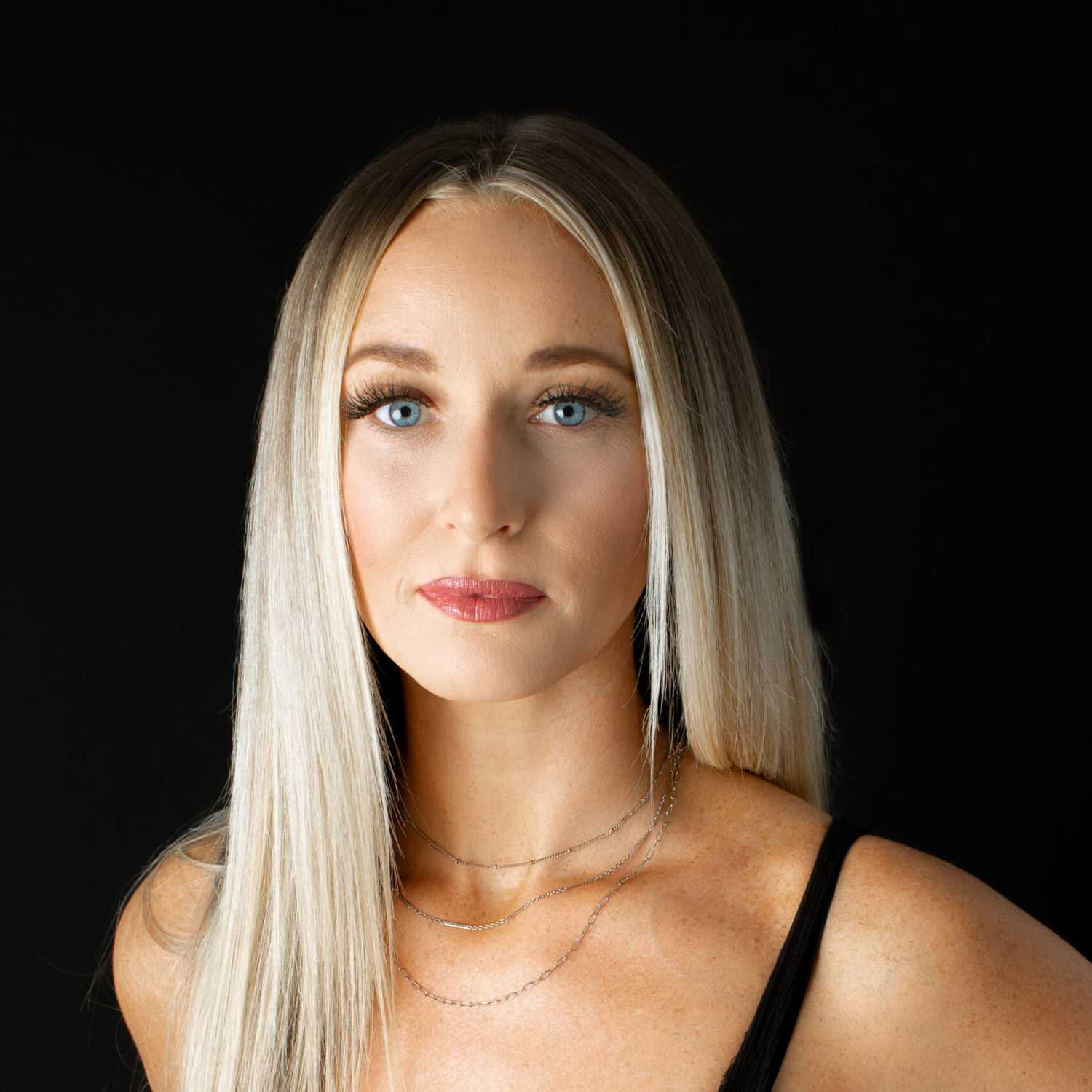Portrait of Gabrielle, a professional stylist at Fusion Salon Avalon, showcasing their expertise and style.