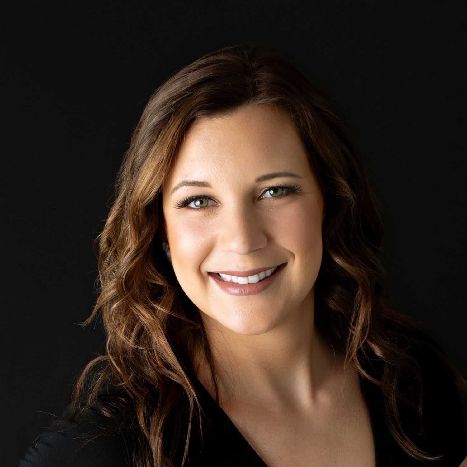 Portrait of Caitlin, a professional stylist at Fusion Salon Avalon, showcasing their expertise and style.