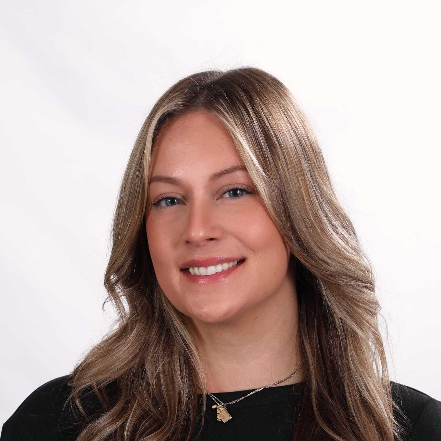 Portrait of Haley, a professional stylist at Fusion Salon Avalon, showcasing their expertise and style.