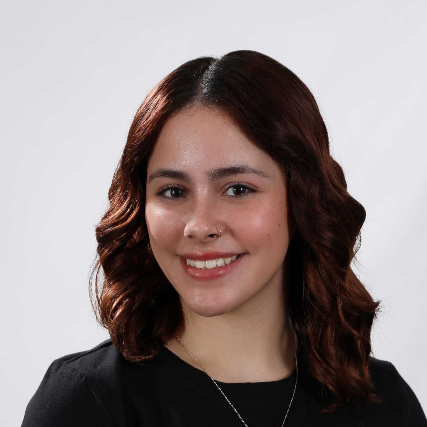 Portrait of Angie, a professional stylist at Fusion Salon Avalon, showcasing their expertise and style.